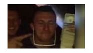 Johnny 'Money' Manziel uses stack of cash as a cellphone