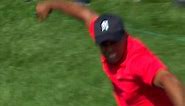 Tiger Woods give a huge fist pump after holing out at the Memorial