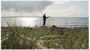 Silhouette man fisher fishing throw rods trolling lake ocean fisherman hook salmon bait fiber glass