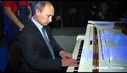 Vladimir Putin plays piano in sing-a-long at Moscow theatre