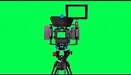 Dslr camera with green screen for video shooting on the tripod with green screen - free use