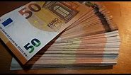 Counting stack of 50 EURO banknotes new and old CASH