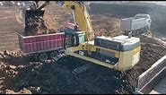 Caterpillar 365C Excavator Loading Mercedes & MAN Trucks - Interkat SA