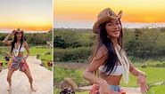 Nicole Scherzinger showcases her toned midriff in white bikini top as she dances to Beyonce's Texas Hold 'Em while soaking up the sun in Hawaii