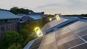 Premium stock video - Solar panels with glowing battery icons