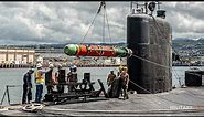 How does the submarine fire a torpedo