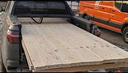 hauling sheets of 4x8 drywall sheets in a 2023 Hyundai Santa cruz