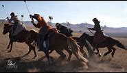 Traditional Mongolian Cavalry performing Horseback Archery . Namnaa Academy archers .