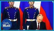 Vladimir Putin signs documents to annexing Ukraine regions