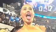 Model Danii Banks flashes in stands during NFL game and is kicked out stadium