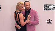 Donnie Wahlberg and Jenny McCarthy look loved up at the AMAs