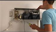 Replacing large batteries in emergency light unit