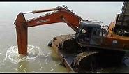 Tata Hitachi Ex-600 excavator fitted with breaker attachment for under water braking job