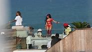 Nicki Minaj showing some skin with body chain around her booty