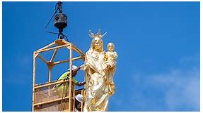 Statue of Mary with Jesus placed on dome of new St. Mary’s Catholic Center