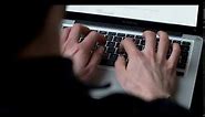 Stock Footage of man Typing on Laptop 4K