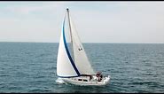 S.V. Thanks Dad - A sunny sailing day on Lake Michigan with winds to 15 knots and wave around 1 ft.