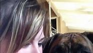 A woman and a Boxer dog take turns sticking their tongues out at the camera! 🤣 (🎥: ViralHog)