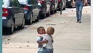 Two Toddlers Adorably Hug Each Other While Running Down Street