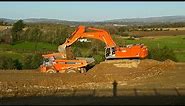 Hitachi Zaxis 870 LCH excavator earthmoving with Hitachi EH1100 dump trucks