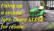 Another yellow deck John Deere STX38 for resale. Let's look over things on this older riding mower.