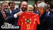 May receives footballer Eden Hazard's shirt from Belgian PM