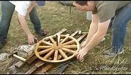 How to install a steel tire on a wooden spoked wagon wheel.