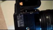 How to insert the battery on a DSLR Nikon camera