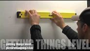 The best way to hang your picture frames straight and in a row