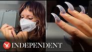 Nail artist creates 'claws' in Halloween-inspired look