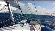 Sailing Hunter 28.5 sailboat upwind into ocean chop