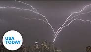 New York City skyline lit up by upward lightning during powerful storm | USA TODAY