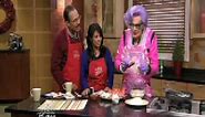 Dame Edna cooking with sausages on The View From The Bay LIVE
