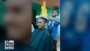 Barber lights customer's hair on fire during unbelievable haircut