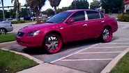 Pink Nissan Altima on 24s