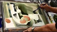 Sterling Edwards paints a watercolor demo of an abstract still life at the Casa.