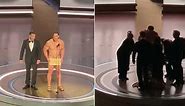 John Cena quickly changes into robe after nude Oscars skit