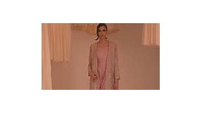 PIXIE A raw silk pink short jacket, fully hand embellished in three dimensional techniques using salma, crystals,pearls ,silver gotta and shades of pink resham, paired with a raw silk jumpsuit that has a shamoz silk drape on one side. #ayeshaandusman #aura #luxuryformals #availablenow | Ayesha and Usman