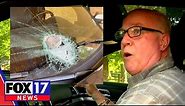 Rock hits windshield while driving on freeway, Paul Brown says it was thrown from overpass