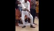 African man dancing his way in Church