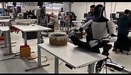 Robot Tesla folding a shirt