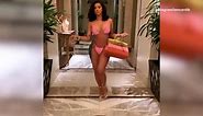 Cardi B flaunts her curves as she struts in stunning pink bikini