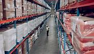 Shipping storage and shelves with warehouse person counting stock for logistics