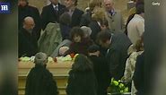 Somber family and friends attend the funeral of John Belushi