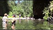Beautiful Punchbowl Falls and People Swimming There