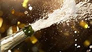 Super slow motion of Champagne explosion with flying cork closure and fireworks, opening champagne bottle closeup.