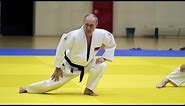 Black belt Putin shows off judo moves with Olympic athletes