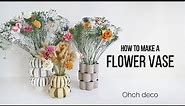 Make a flower vase with recycled materials