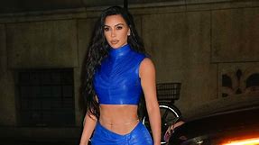 Kim Kardashian Looks Gorgeous in a Royal Blue Skirt Set with a Thigh Slit and Belly Chain
