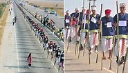 Over 700 people walks on stilts together to break world record